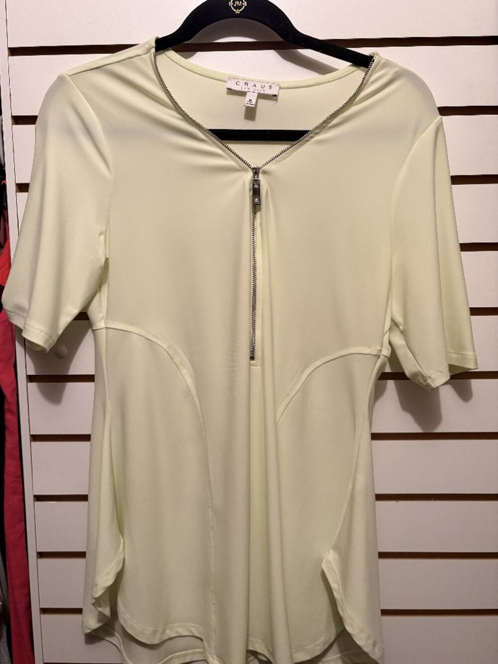 Soft green short-sleeve zippered top